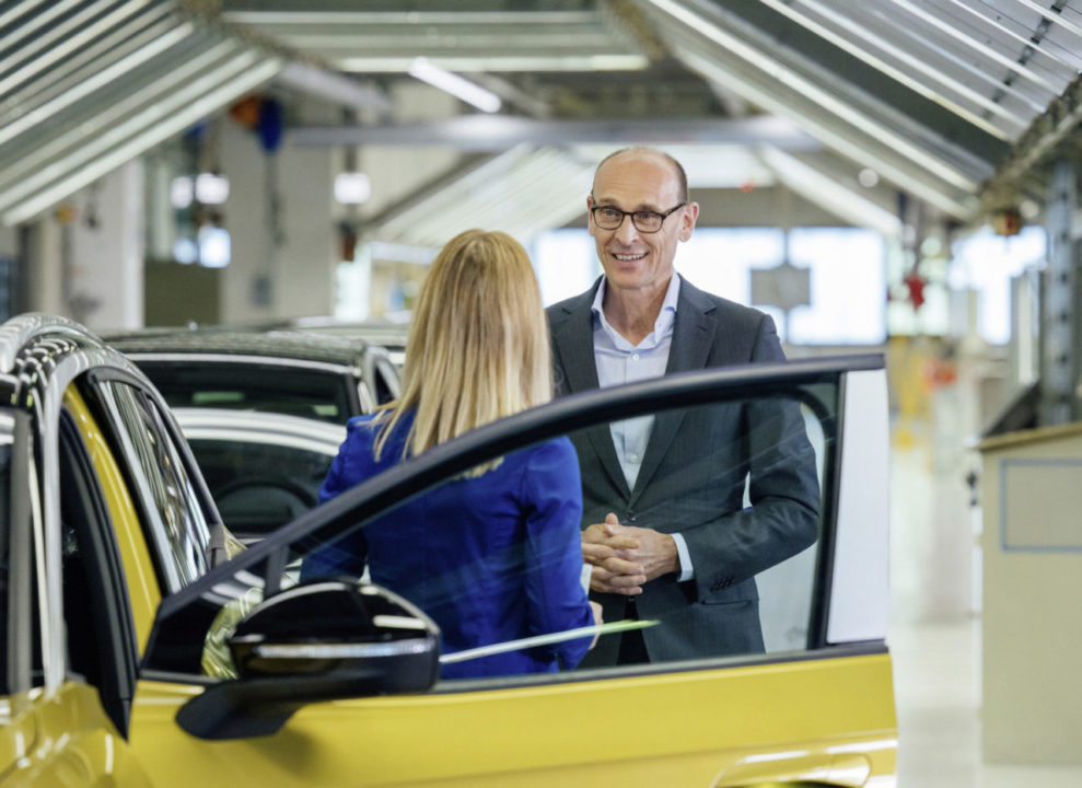 Volkswagen brand CEO Ralf Brandstätter standing next to the first series vehicle “made in Saxony” at the start of ID.4 series production in Zwickau.