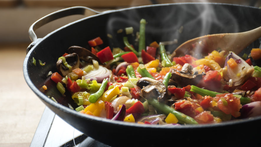steaming mixed vegetables in the wok, asian style cooking